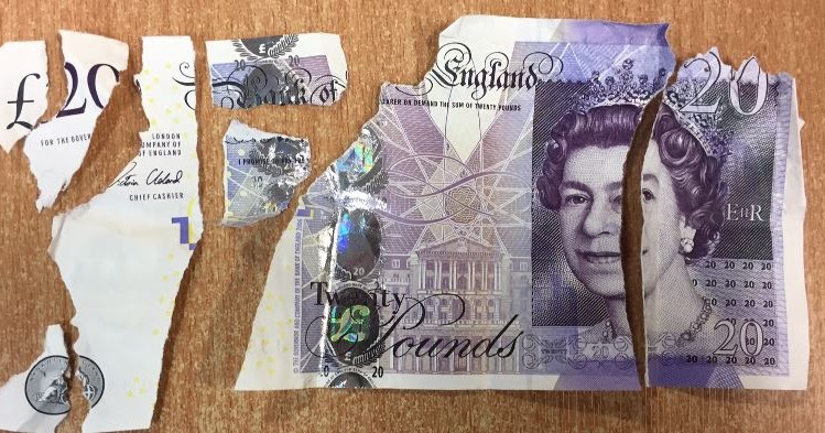 Damaged bank notes.The Queen's head appears on English bank notes, and 'lady' refers to this.